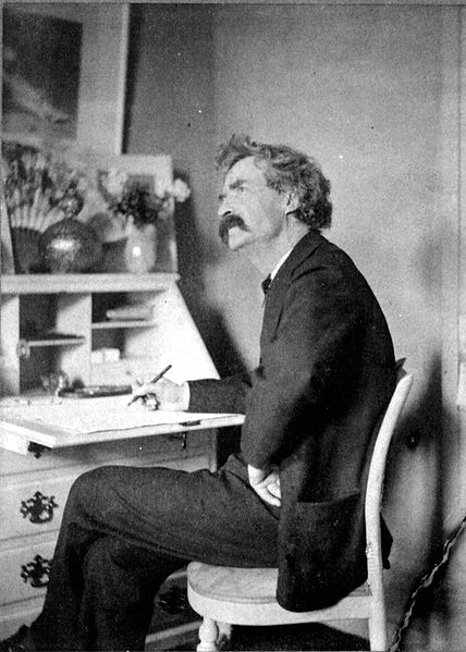 Mark Twain pondering at his desk